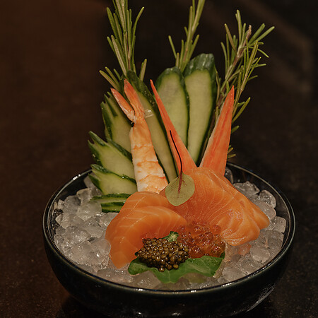 Sashimi on ice with black background