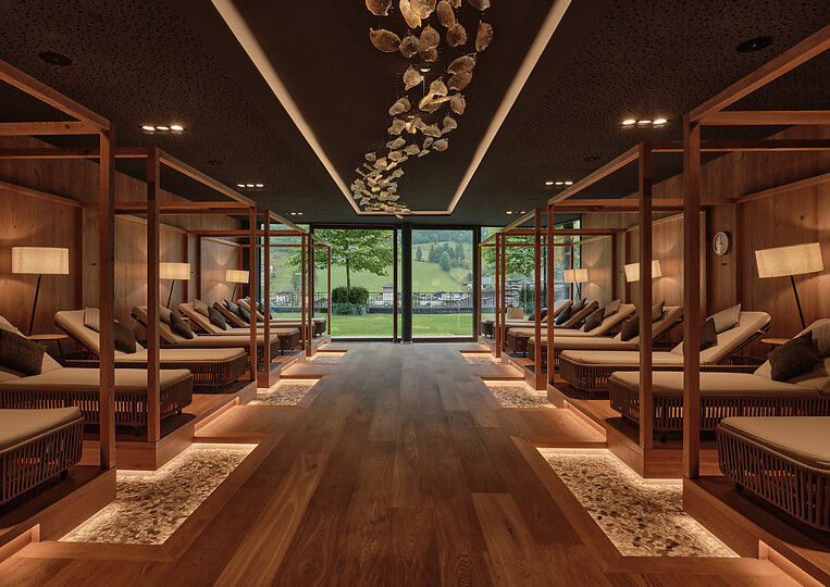 Relaxation room in the Adults Only area with views of the green mountain landscape