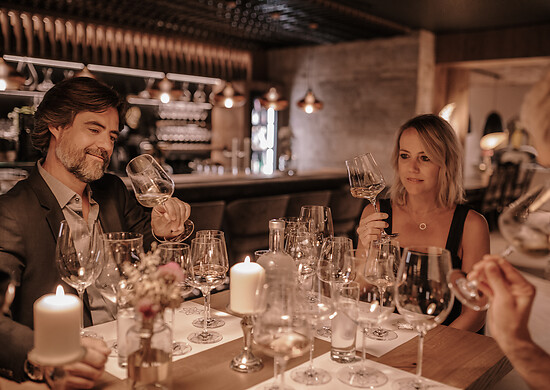 A couple takes part in a wine tasting with overnight stay