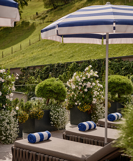 Spa area outside with nature and white-blue sun shades