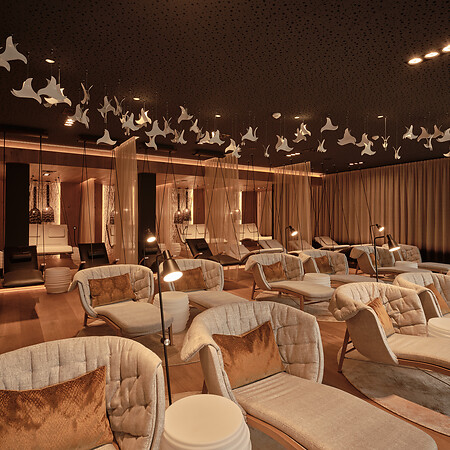 Relaxation room in Austrian sauna with hanging loungers and heated loungers Decoration hanging from the ceiling