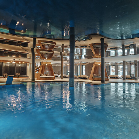 Family spa area in Salzburger Land with indoor pool and mirrored ceiling
