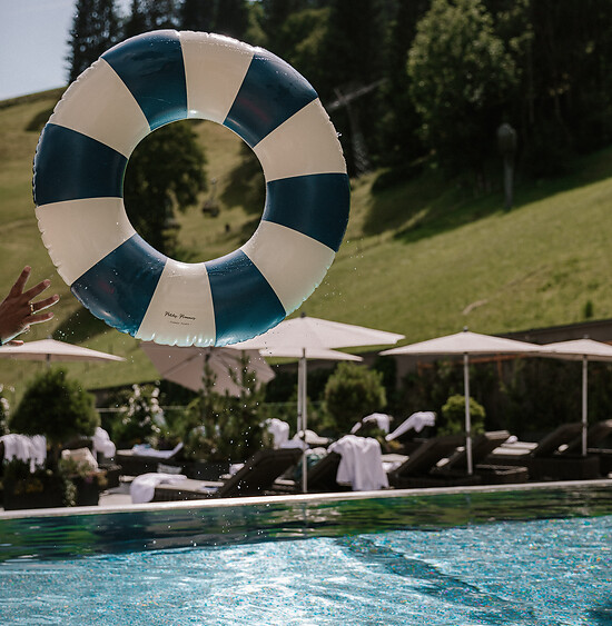 Blue and white striped swimming ring in the Family Friendly Hotel with Pool