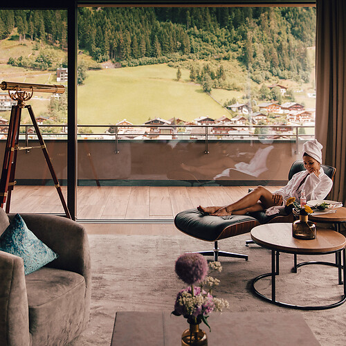 Lady sitting on a lounge chair in the design hotel Austria
